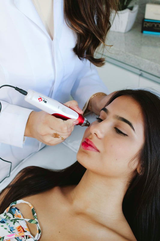 A woman getting her hair styled by a professional hair stylist