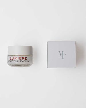 Hydrating LUMIÈRE facial cream by Theris Cosmetici in a sleek jar, showcasing its creamy texture and elegant packaging.